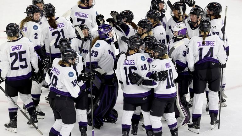 Minnesota celebrates their win over Boston at the end of...