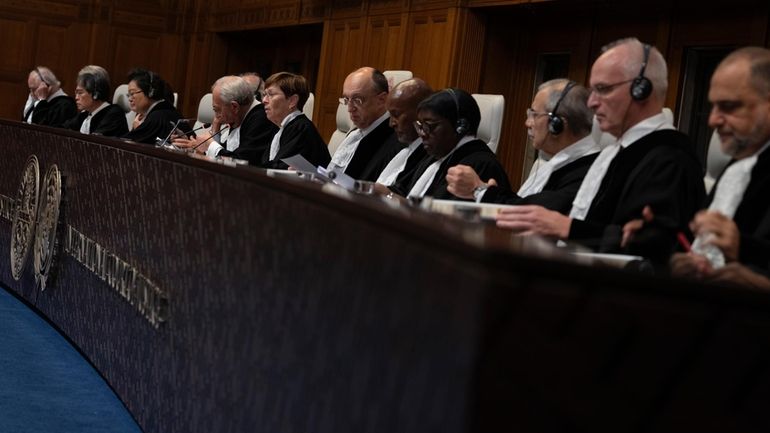 Presiding judge Joan Donoghue, center, opens preliminary hearings in a...