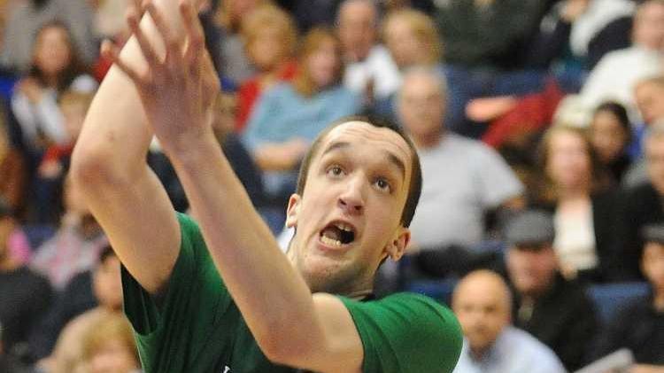 Harborfields senior Reed McLean, left, attempts to shoot over South...