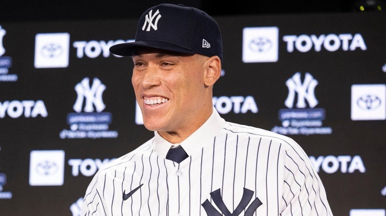 Aaron Judge is all smiles at the news conference announcing his new...