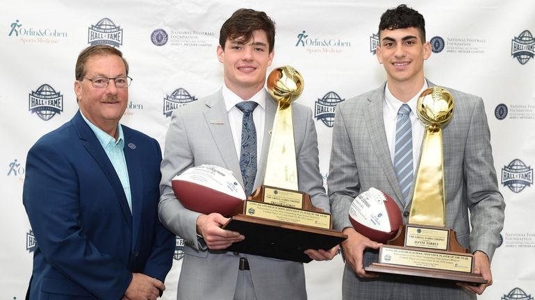 Trevor Gayron of Farmingdale, center, and Dante Torres of St....