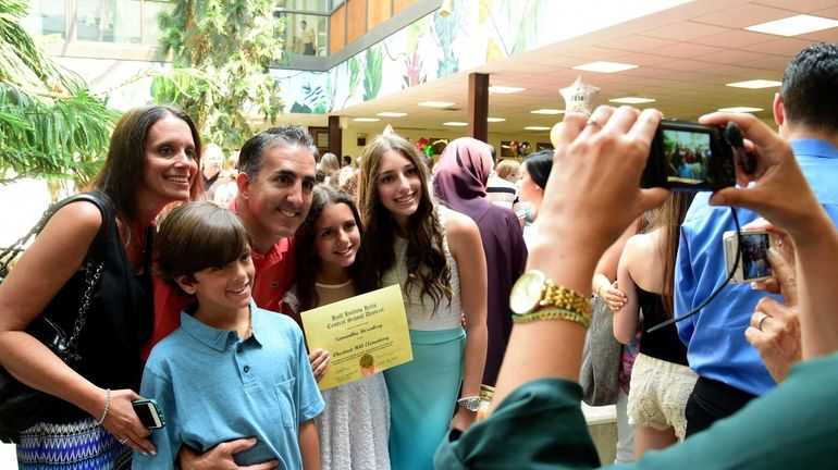 The Rosenberg family of Melville from left, Beth, Dylan, 9,...