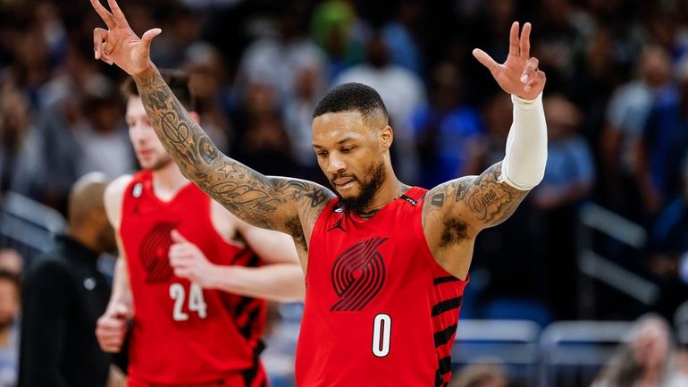 Portland Trail Blazers guard Damian Lillard (0) celebrates after a...