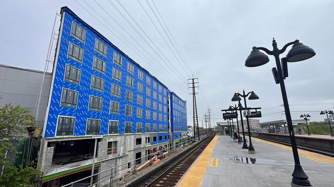 New Lynbrook apartment building rises across from train station - Newsday