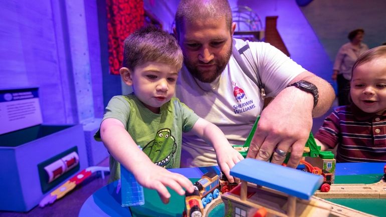 Joe Bombarbiere, of Glen Cove, and his son, Dominick, 2,...