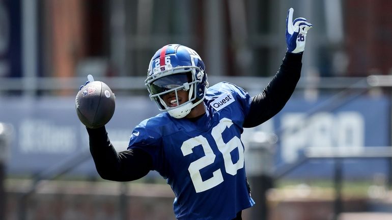 New York Giants running back Saquon Barkley (26) reacts after...