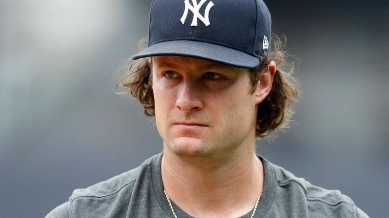 Gerrit Cole #45 of the Yankees walks on the field at...