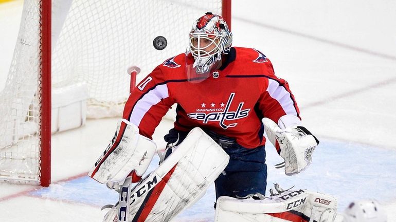 Washington Capitals goaltender Braden Holtby (70) watches the puck during...