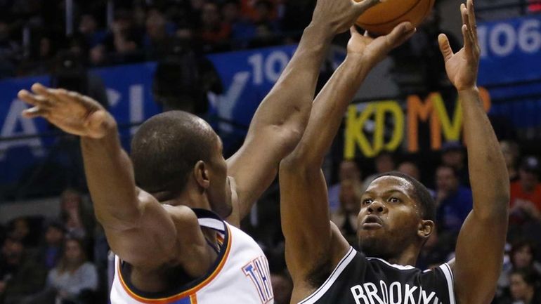 Nets guard Joe Johnson shoots as Oklahoma City Thunder forward...