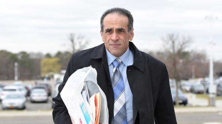 Michael Belfiore arrives at federal court in Central Islip in April...