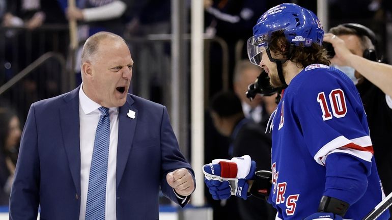 Rangers head coach Gerard Gallant fist bumps left wing Artemi...