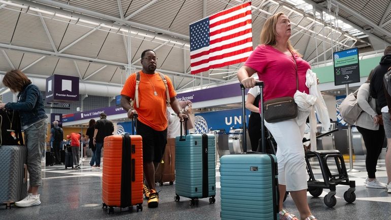 Passengers pass through O'Hare airport in Chicago, Illinois. Google Flights released...