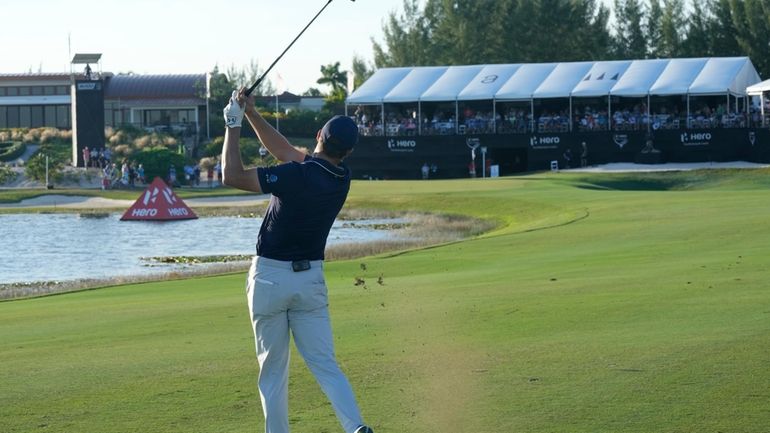 Jordan Spieth, of the United States, hits from the 18th...