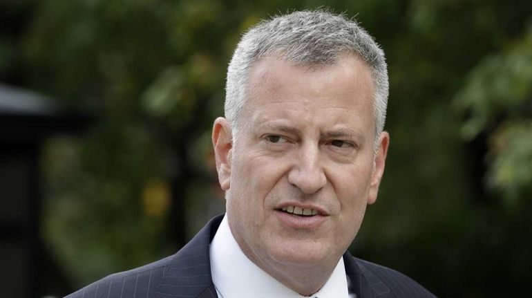 Mayor Bill de Blasio arrives at City Hall in Manhattan...