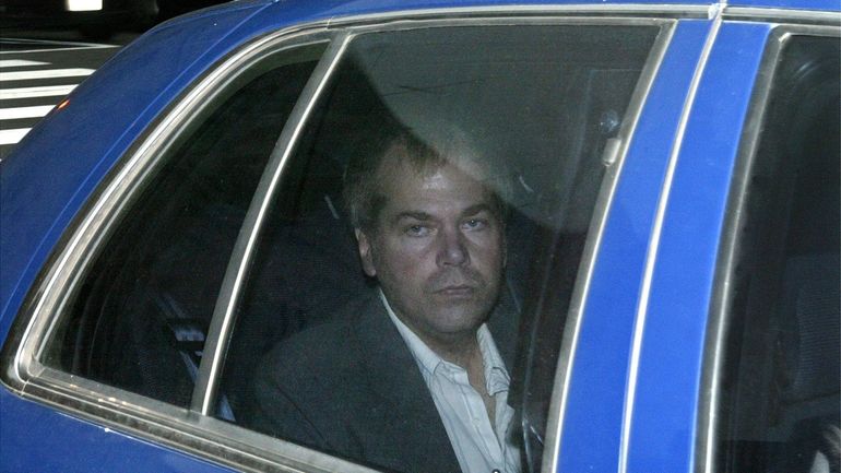 John Hinckley Jr. arrives at U.S. District Court, Nov. 18,...