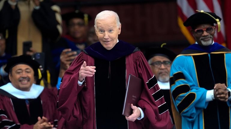 President Joe Biden gestures after speaking to graduating students at...