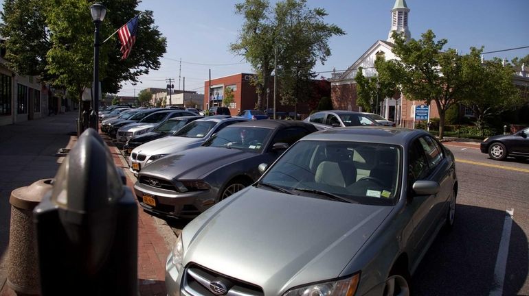 Cars are parked on Wellwood Avenue in Lindenhurst on Wednesday,...