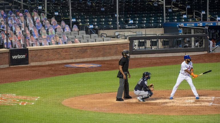 The New York Mets have card board photos of fans...