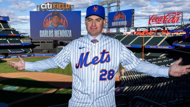 Carlos Mendoza stands above Citi Field after being announced as...