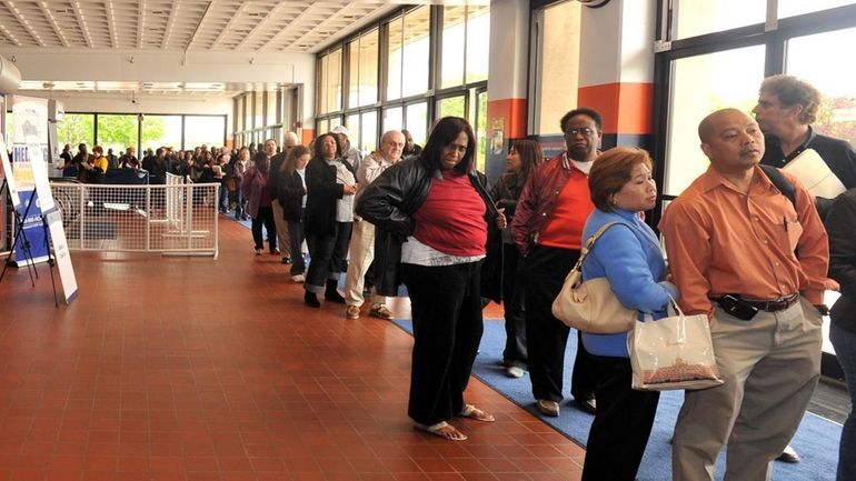 About 500 people jam the box office vestibule Tuesday at...