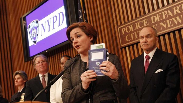 City Council Speaker Christine Quinn, speaking, is joined by Police...