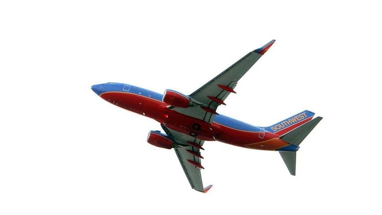 A later model Southwest Boeing 737 takes off from LI...