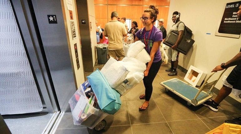 Junior Sabrina Grunseich, 19, of Deer Park, moves into new...