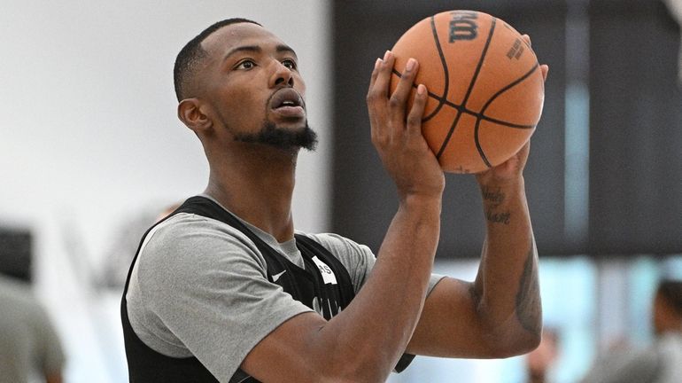 Brooklyn Nets forward Harry Giles III shoots during training camp...