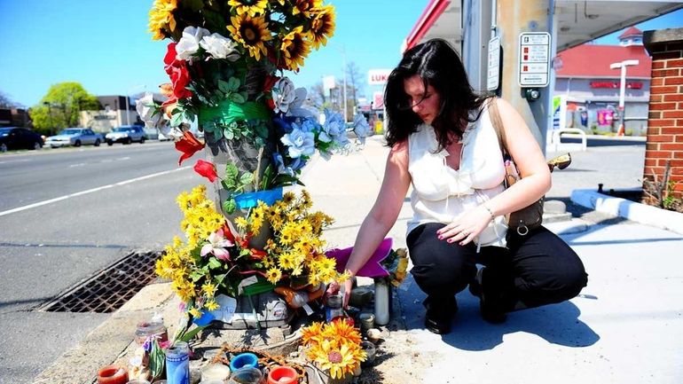 Sandi Vega tends a makeshift memorial for her daughter Brittany...