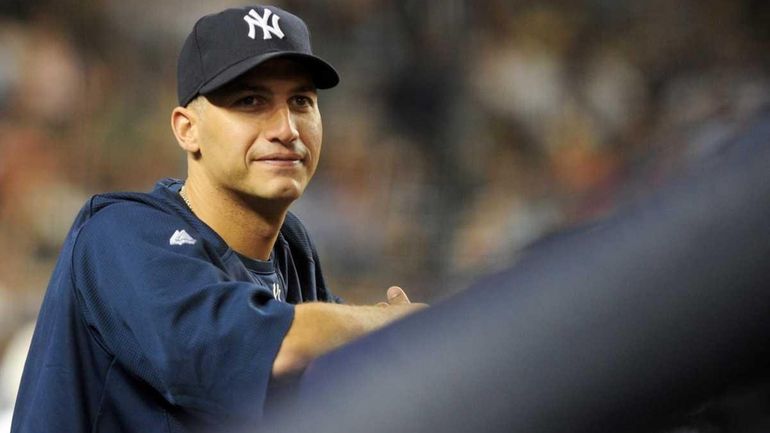 New York Yankees pitcher andy pettitte in the dugout during...