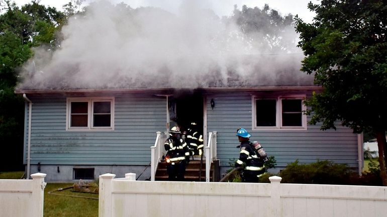 Firefighters at the scene of a fatal fire on Ferndale...