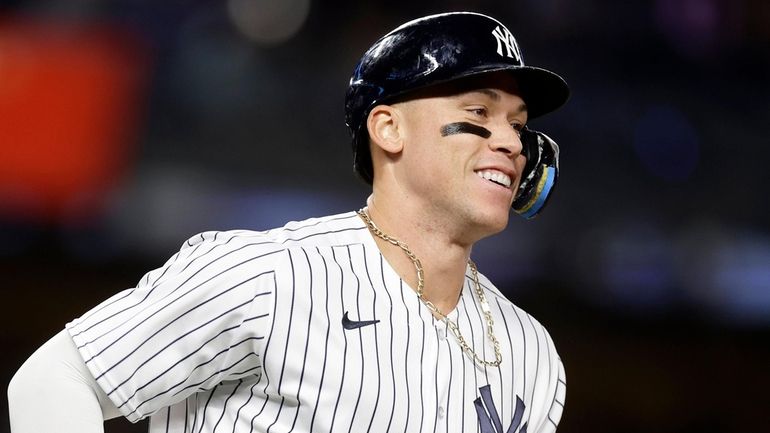 Aaron Judge of the Yankees runs the bases after his seventh-inning home...