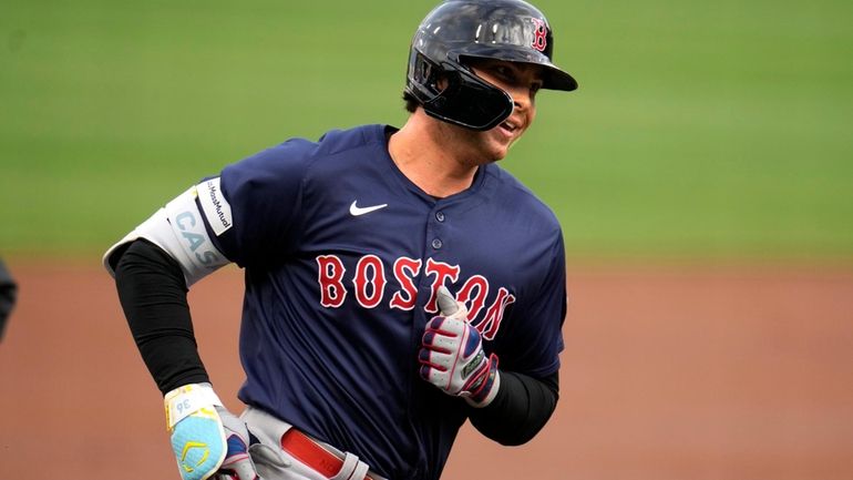 Boston Red Sox's Triston Casas rounds third base after hitting...