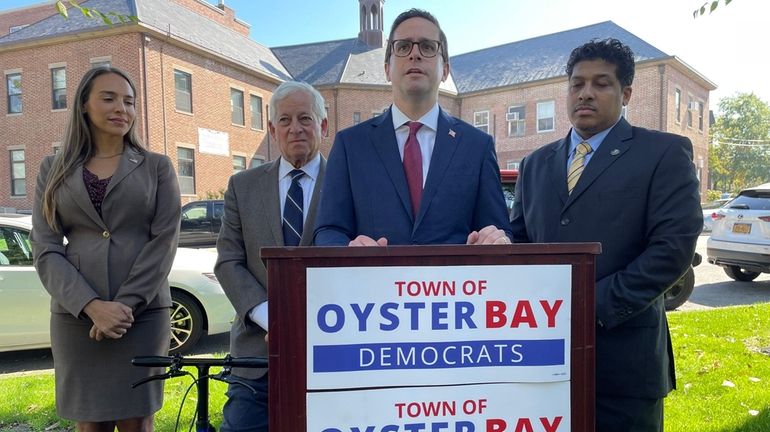 Jared Behr, center, the Democratic candidate for Oyster Bay town supervisor,...