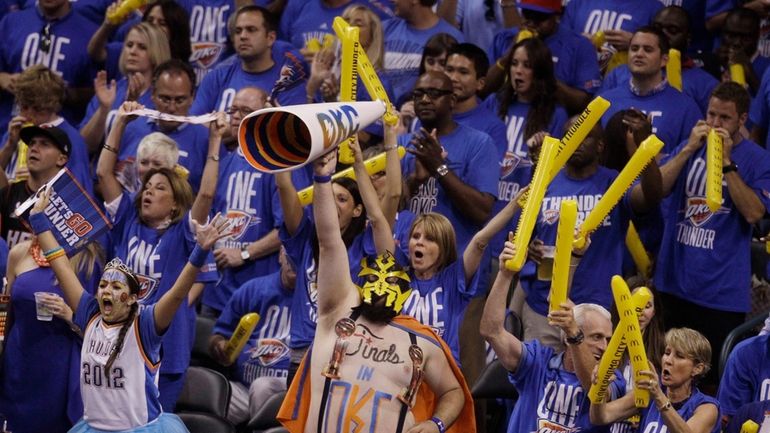 Oklahoma City Thunder fans cheer the team on against the...