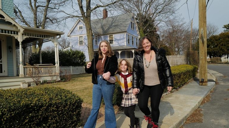 Kayte Camarata, of Huntington, and her daughters Liva, 14, and...