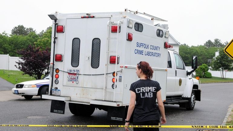 Suffolk County crime lab investigators on Camden Court in Medford...