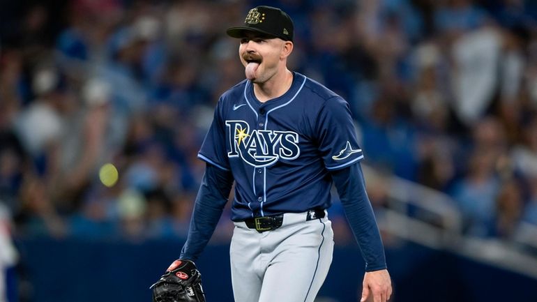 Tampa Bay Rays pitcher Tyler Alexander (14) reacts while walking...