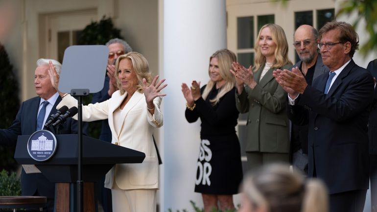 First lady Jill Biden, with actors Martin Sheen, left, Aaron...