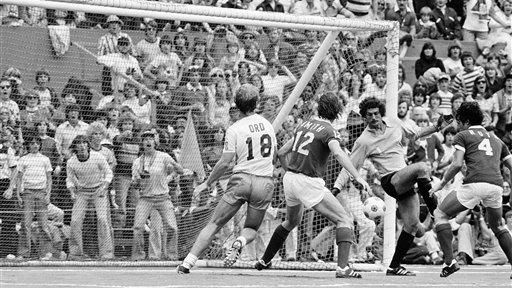 Cosmos' goalie Shep Messing, third from left, blocks a shot...