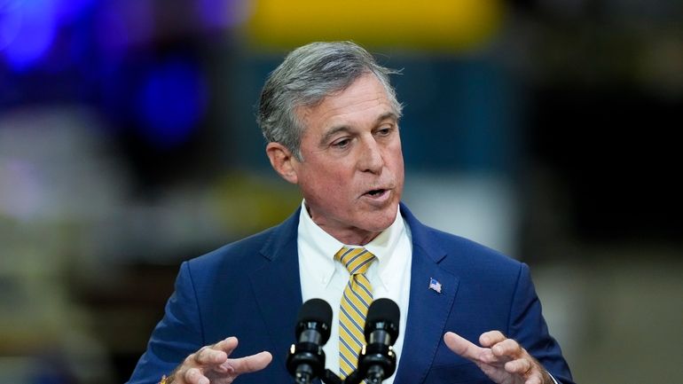 Delaware Gov. John Carney speaks at an Amtrak facility in...