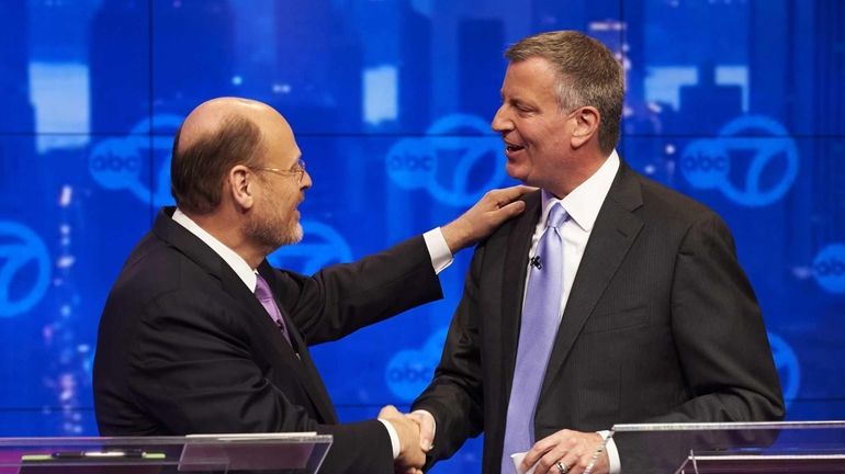 New York City Democratic mayoral candidate Bill de Blasio, right,...