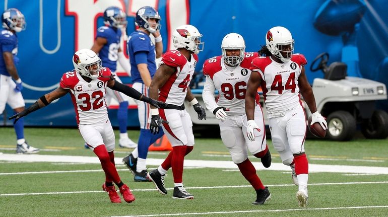 Markus Golden #44 of the Arizona Cardinals celebrates his first...