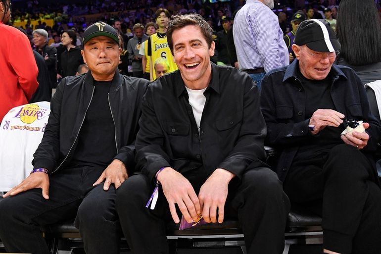 Kendall Jenner, center, sits courtside with Bad Bunny during the second  half in Game 6 of an NBA basketball Western Conference semifinal series  between the Los Angeles Lakers and the Golden State