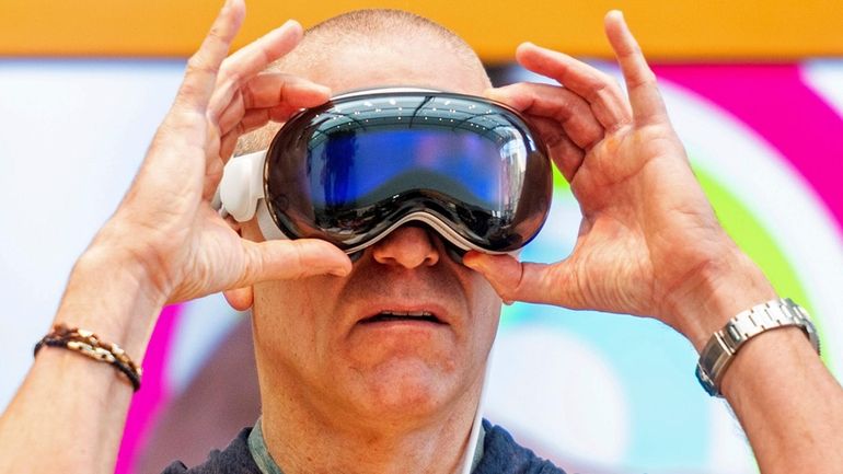 Scott Joachim tries out an Apple Vision Pro headset during...