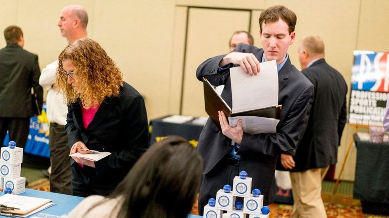 Ryan Solan of Merrick, meets with Sharon Crane Priest of...