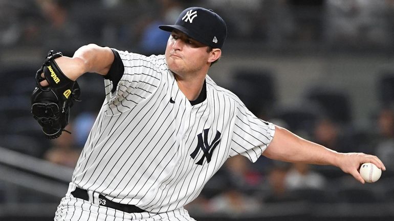 Yankees relief pitcher Zack Britton delivers against the Red Sox...