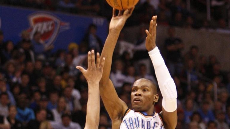 Oklahoma City Thunder's Kevin Durant (35) shoots over Denver Nuggets...