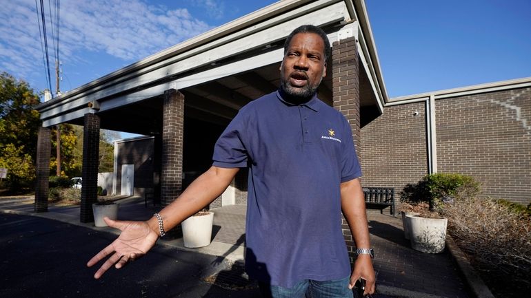 Otis Wells, 51, stands in front of his Clinton, Miss.,...