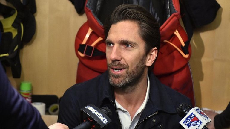 Henrik Lundqvist of the Rangers speaks with the media inside...